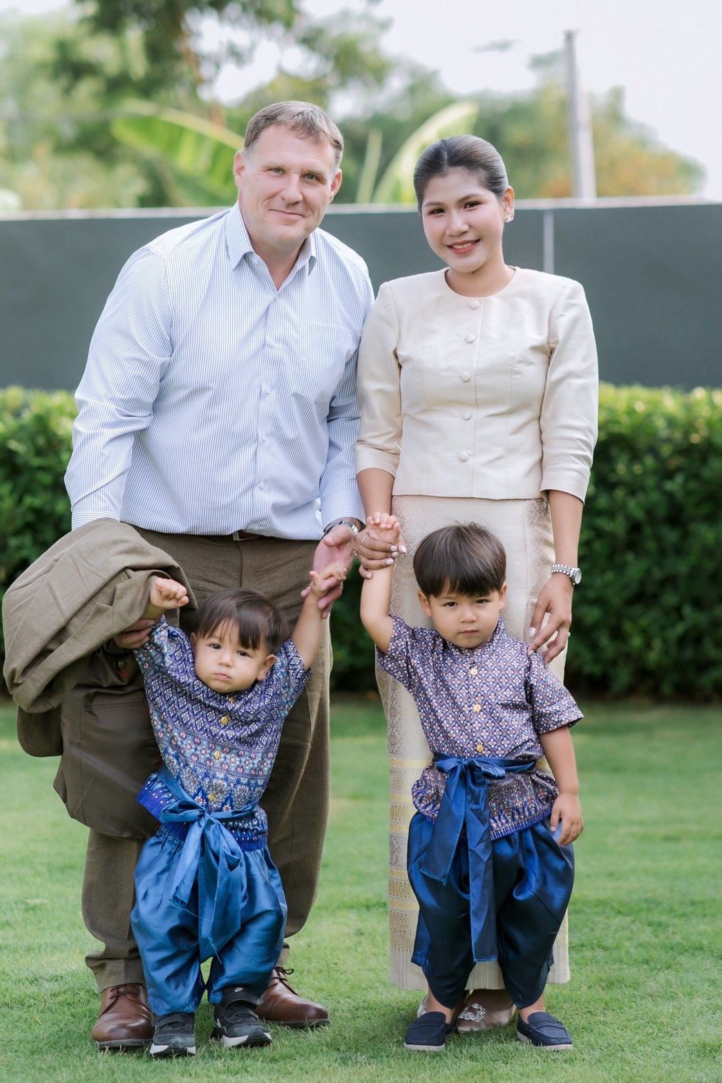 The Cunningham family in matching traditional Thai outfits