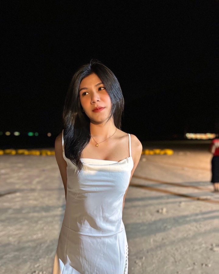 Ploy in a white dress